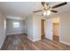 This bedroom features neutral paint, vinyl flooring and a walk-in closet at 4827 Elese St, Orlando, FL 32811