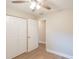 This bedroom features vinyl flooring and closet at 4827 Elese St, Orlando, FL 32811