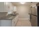 Bright kitchen featuring granite countertops, stainless steel appliances, and ample cabinet space at 4827 Elese St, Orlando, FL 32811