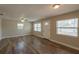 Comfortable living room with hardwood floors and plenty of natural sunlight at 4827 Elese St, Orlando, FL 32811