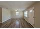 Spacious living room featuring hardwood floors and abundant natural light at 4827 Elese St, Orlando, FL 32811