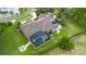 Aerial view of the home highlighting the backyard, pool area and outdoor entertainment spaces at 5025 Down Point Ln, Windermere, FL 34786