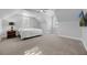 Attic bonus room with carpeting, two windows and a bed at 5025 Down Point Ln, Windermere, FL 34786