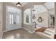 Bright foyer with tile flooring, arched entryways, and elegant chandelier at 5025 Down Point Ln, Windermere, FL 34786