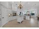 Bright kitchen featuring white cabinetry, granite countertops, and stainless steel appliances at 5025 Down Point Ln, Windermere, FL 34786
