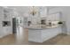Spacious kitchen with white cabinetry, granite countertops, and stainless steel appliances at 5025 Down Point Ln, Windermere, FL 34786