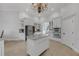 Bright, open kitchen with white cabinetry, stainless steel appliances, and a granite-topped island at 5025 Down Point Ln, Windermere, FL 34786