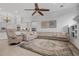 Spacious living room with neutral tones, large sectional sofa, and elegant decor at 5025 Down Point Ln, Windermere, FL 34786