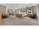 Large main bedroom featuring ample space, soft lighting, and a seating area at 5025 Down Point Ln, Windermere, FL 34786