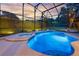 Stunning pool and spa area with a screened enclosure, creating a private outdoor oasis for relaxation at 5025 Down Point Ln, Windermere, FL 34786