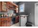 Well-appointed wet bar with custom cabinetry, wine storage, and countertop space at 5025 Down Point Ln, Windermere, FL 34786