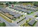 An aerial view showcases the neighborhood layout and the location of a specific home at 5089 Meadow Song Dr, Okahumpka, FL 34762