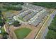 Expansive aerial shot showcases a new residential community with ponds, landscaping, and well planned road layouts at 5089 Meadow Song Dr, Okahumpka, FL 34762