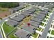 Residential construction aerial featuring modern homes, and manicured lawns in a well-designed neighborhood near a pond at 5089 Meadow Song Dr, Okahumpka, FL 34762
