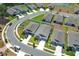 Aerial view of modern homes with manicured lawns and white fences in a well planned residential community at 5089 Meadow Song Dr, Okahumpka, FL 34762