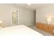 Neutral bedroom with soft carpet and an adjoining bathroom creating a calming retreat at 5089 Meadow Song Dr, Okahumpka, FL 34762