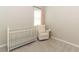 Bedroom featuring a white rocking chair, natural light, and a cozy atmosphere at 5089 Meadow Song Dr, Okahumpka, FL 34762