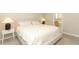 Warm bedroom with simple decor and bedside lamps for a cozy and inviting space at 5089 Meadow Song Dr, Okahumpka, FL 34762