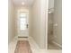 Bright foyer with tile flooring, leading into the home's inviting living spaces at 5089 Meadow Song Dr, Okahumpka, FL 34762