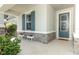 Charming front entrance with decorative door and stone accents. Perfect for welcoming guests at 5089 Meadow Song Dr, Okahumpka, FL 34762