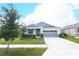 Charming single-story home with a well-manicured lawn and inviting curb appeal at 5089 Meadow Song Dr, Okahumpka, FL 34762
