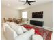Cozy living room featuring a spacious seating area and ample natural light at 5089 Meadow Song Dr, Okahumpka, FL 34762