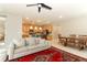Open-concept living space featuring a modern kitchen and comfortable living area at 5089 Meadow Song Dr, Okahumpka, FL 34762