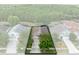 An aerial view of the home, showing its placement on the street and a mature shade tree at 516 Brett Ct, Orlando, FL 32828