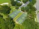 Aerial view of well-maintained community basketball courts surrounded by lush greenery and convenient parking at 516 Brett Ct, Orlando, FL 32828