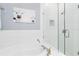 Serene bathroom featuring a soaking tub with shower, glass shower and tile backsplash at 516 Brett Ct, Orlando, FL 32828
