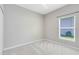 Clean, carpeted bedroom with natural light and window with view of exterior at 516 Brett Ct, Orlando, FL 32828