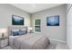 Staged bedroom features carpet, ample natural light, and modern decor at 516 Brett Ct, Orlando, FL 32828