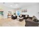 Bright living room features neutral decor, updated floors, ceiling fan, and comfortable seating at 516 Brett Ct, Orlando, FL 32828