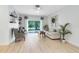 Bright living room features sliding glass doors to the backyard and neutral decor at 516 Brett Ct, Orlando, FL 32828