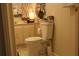 Simple bathroom featuring a toilet, sink, and basic fixtures, offering functionality and convenience at 518 W Plantation Blvd, Lake Mary, FL 32746