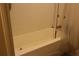 Standard bathtub with white tiles and a simple showerhead, ready for a relaxing bath at 518 W Plantation Blvd, Lake Mary, FL 32746
