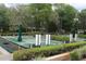 Lush community greenspace with bocce courts and manicured hedges, perfect for outdoor enjoyment at 518 W Plantation Blvd, Lake Mary, FL 32746