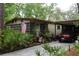 Charming single-story home featuring a carport and well-manicured landscaping with an American flag at 518 W Plantation Blvd, Lake Mary, FL 32746