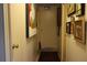 Hallway with artwork and neutral decor, creating a warm and inviting transition space at 518 W Plantation Blvd, Lake Mary, FL 32746