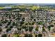 Discover a new neighborhood from above, featuring trees and a green pin at 520 Stonewall Ave, Haines City, FL 33844