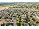Explore diverse real estate options from above, featuring well-established neighborhoods with mature trees at 520 Stonewall Ave, Haines City, FL 33844