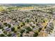 Explore real estate options with this aerial view of a neighborhood with trees at 520 Stonewall Ave, Haines City, FL 33844