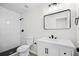 Updated bathroom featuring a tiled shower, modern vanity, and black fixtures at 520 Stonewall Ave, Haines City, FL 33844