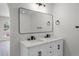 Bathroom features a double vanity, modern fixtures, and plenty of storage for added convenience at 520 Stonewall Ave, Haines City, FL 33844