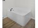 Bright bathroom featuring a clean, white tub perfect for relaxation after a long day at 520 Stonewall Ave, Haines City, FL 33844