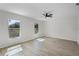 Bright bedroom featuring two windows and a ceiling fan at 520 Stonewall Ave, Haines City, FL 33844