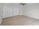 Bedroom featuring light wood floors, ceiling fan, and double closets for ample storage at 520 Stonewall Ave, Haines City, FL 33844