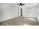 Bright bedroom featuring two windows and a ceiling fan plus double door closet at 520 Stonewall Ave, Haines City, FL 33844