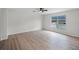 Spacious bedroom with large window allowing natural light and modern flooring at 520 Stonewall Ave, Haines City, FL 33844