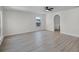 Bright bedroom with wood-look flooring, providing a blank canvas for personalization and relaxation at 520 Stonewall Ave, Haines City, FL 33844